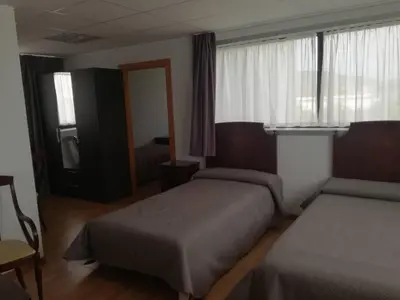 Cama o camas de una habitación en Pension La Espiga
