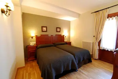 Cama o camas de una habitación en Hotel Bujaruelo