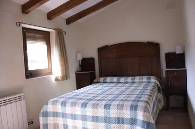 Cama o camas de una habitación en Ca la Nuri