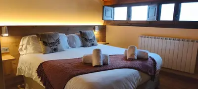 Cama o camas de una habitación en Hotel Saurat