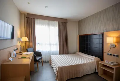 Cama o camas de una habitación en Hotel Salvevir