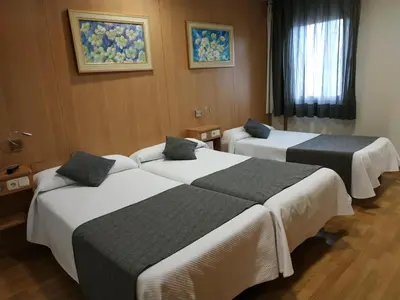 Cama o camas de una habitación en Iraipe Izaga Hostal