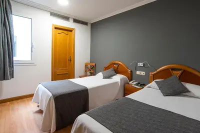 Cama o camas de una habitación en Iraipe Izaga Hostal