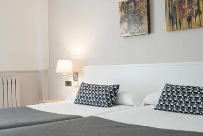 Cama o camas de una habitación en Hotel Rio Arga