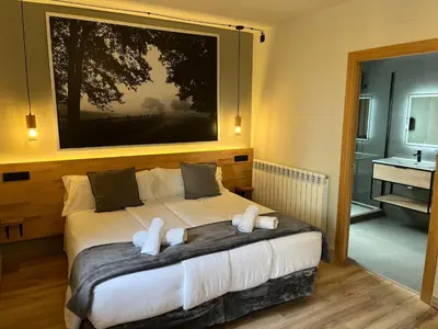 Cama o camas de una habitación en Hotel Els Encantats