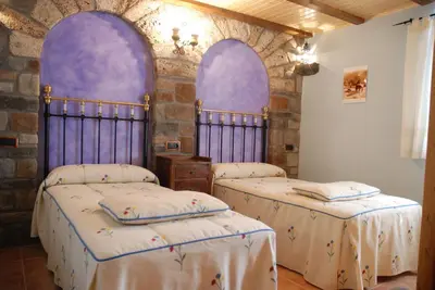 Cama o camas de una habitación en Apartamento el Patio Casa Cajal