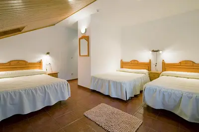 Cama o camas de una habitación en Hotel Castillo d'Acher