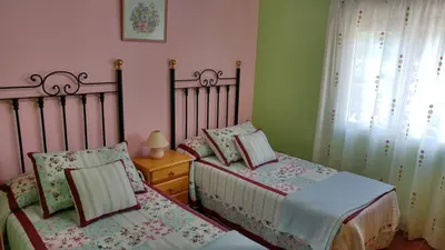 Cama o camas de una habitación en Apartamentos La Flor