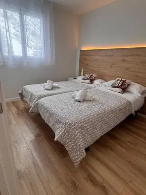 Cama o camas de una habitación en Apartamentos Pirineos Rent