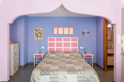 Cama o camas de una habitación en Casa Dieste Apartamentos Turísticos en Boltaña