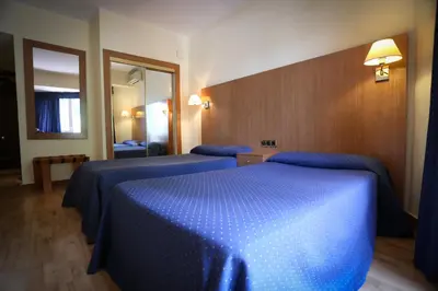 Cama o camas de una habitación en Hotel El Cisne