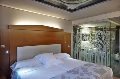 Cama o camas de una habitación en Hotel Sancho Abarca Petit SPA