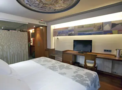 Cama o camas de una habitación en Hotel Sancho Abarca Petit SPA