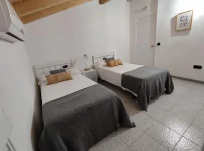 Cama o camas de una habitación en Villa Pachita (por habitaciones)