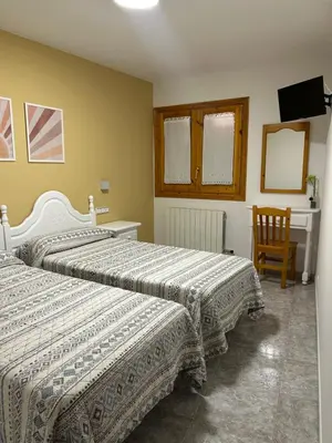 Cama o camas de una habitación en Hostal Casa Vispe