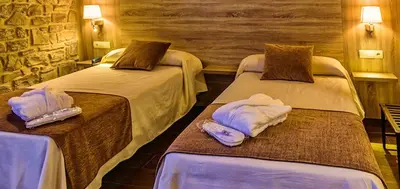 Cama o camas de una habitación en Hotel Balneari de Vallfogona de Riucorb