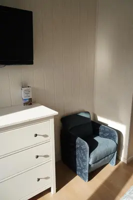 Una televisión o centro de entretenimiento en Hotel Tirol