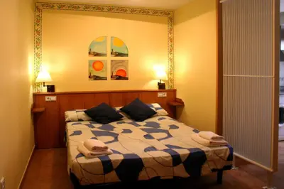 Cama o camas de una habitación en Hotel Casa Domenc