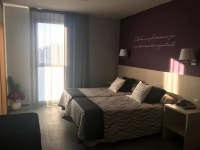 Cama o camas de una habitación en Hotel HM Alfaro