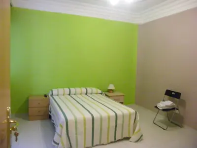 Cama o camas de una habitación en Pensión Corona
