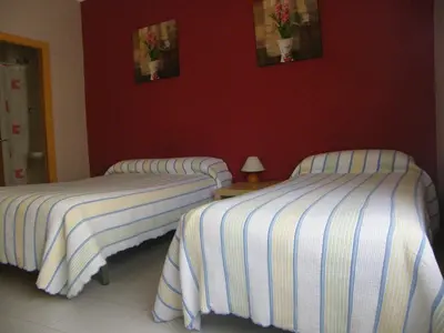 Cama o camas de una habitación en Pensión Corona