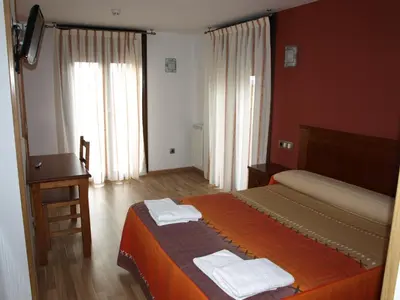 Cama o camas de una habitación en El Churrón