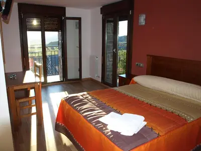 Cama o camas de una habitación en El Churrón