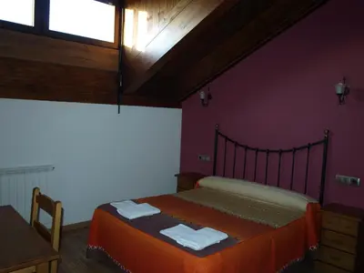 Cama o camas de una habitación en El Churrón
