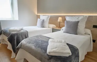 Cama o camas de una habitación en Hotel Anglada