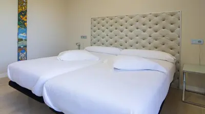 Cama o camas de una habitación en RuralSuite Hotel Apartamentos