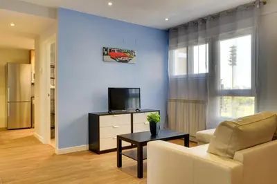 Una televisión o centro de entretenimiento en Apartamentos San Lázaro