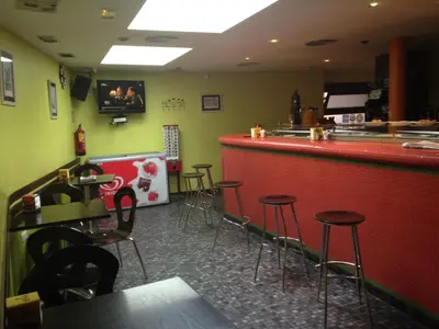 El salón o zona de bar de Hotel Asador O Callejón De Belchite