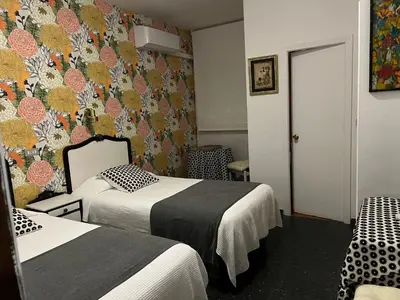 Cama o camas de una habitación en Hostal Pirineos