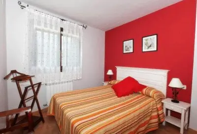 Cama o camas de una habitación en Apartamentos Pirineos Ordesa