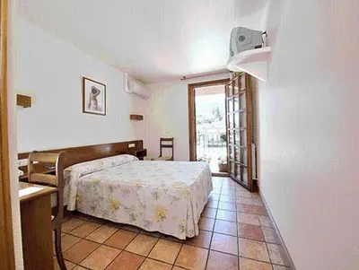 Cama o camas de una habitación en Hostal Lorentxo