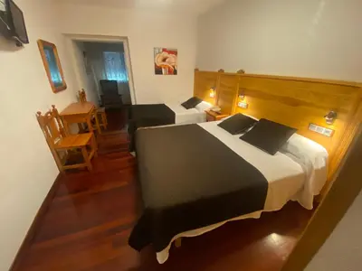 Cama o camas de una habitación en Hotel La Rambla