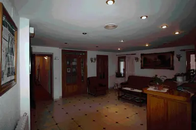 Una televisión o centro de entretenimiento en Hotel Can Mestre