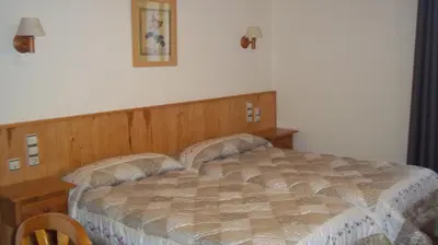 Cama o camas de una habitación en Hostal Pernalle