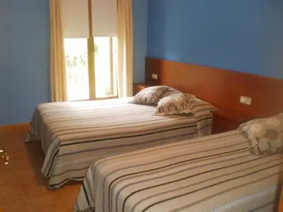 Cama o camas de una habitación en Hostal Pernalle