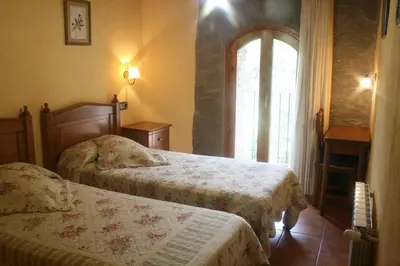 Cama o camas de una habitación en El Raco de Cal Maro