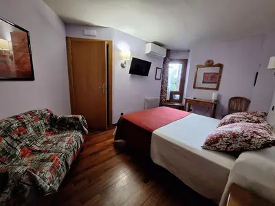 Cama o camas de una habitación en Hotel Aragüells
