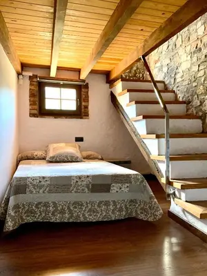 Cama o camas de una habitación en El celler de Cal Garriga