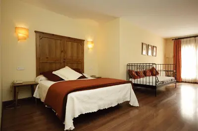 Cama o camas de una habitación en Hotel Pirineos