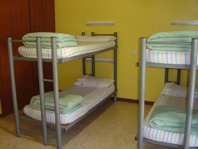 Cama o camas de una habitación en Albergue Era Garona
