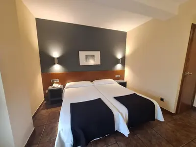 Cama o camas de una habitación en Hotel Yerri