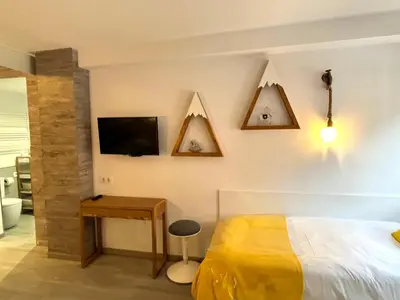 Cama o camas de una habitación en UP BENASQUE FLOR de NIEVE