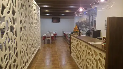 Un restaurante o sitio para comer en Hotel Apolo