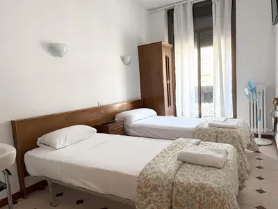 Cama o camas de una habitación en Hostel Central Zaragoza