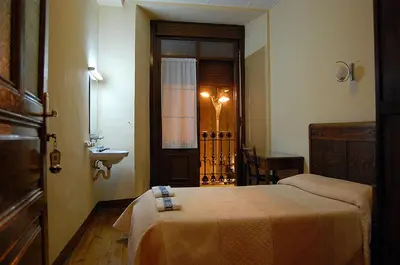 Cama o camas de una habitación en Hostal Paris