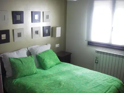 Cama o camas de una habitación en vivienda isabel